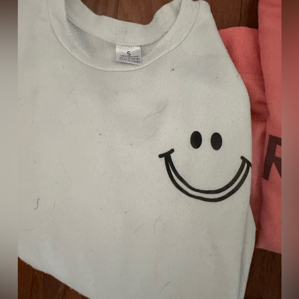 White smiley face crew neck